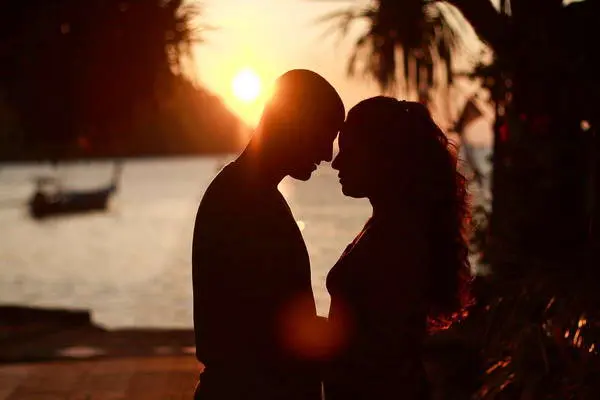 honeymoon photo shoot with a stunning sunset in the background